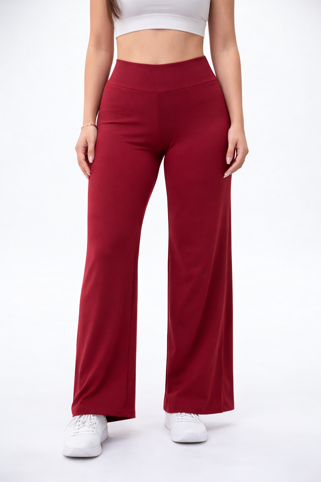 Red wide-leg pants worn by a person on a white background