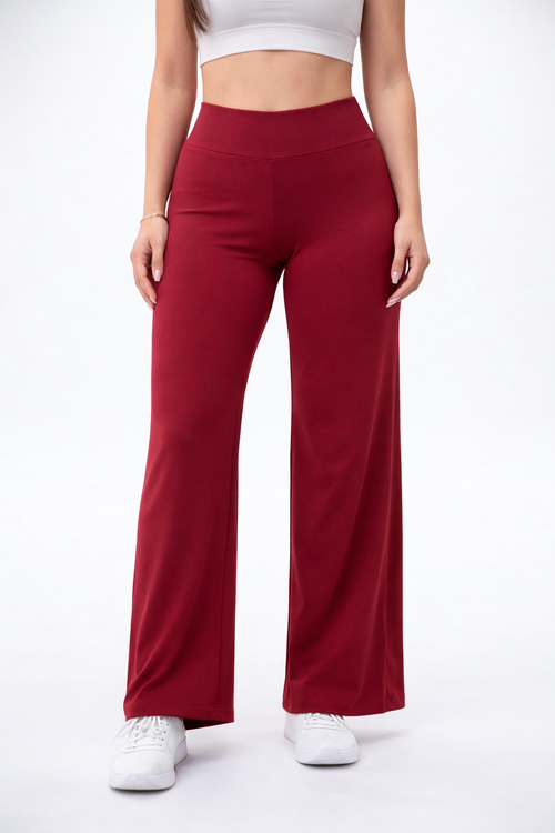Red wide-leg pants worn by a person on a white background